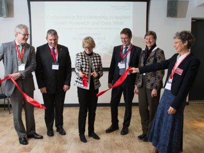 Dame Sally Davies cuts the ribbon at launch.