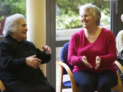 Two older women enjoying themselves at a Healthy Living Club
