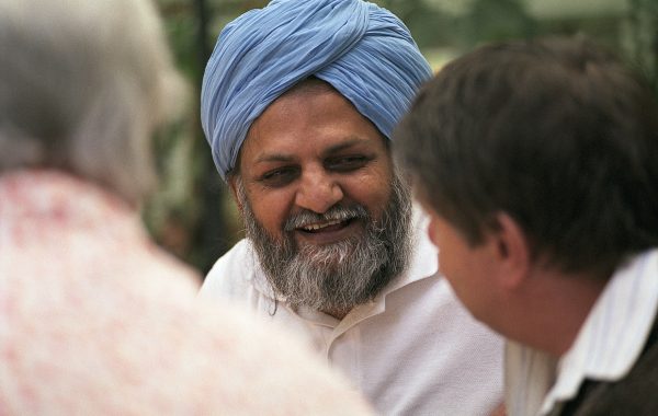 Older South Asian men talking and laughing