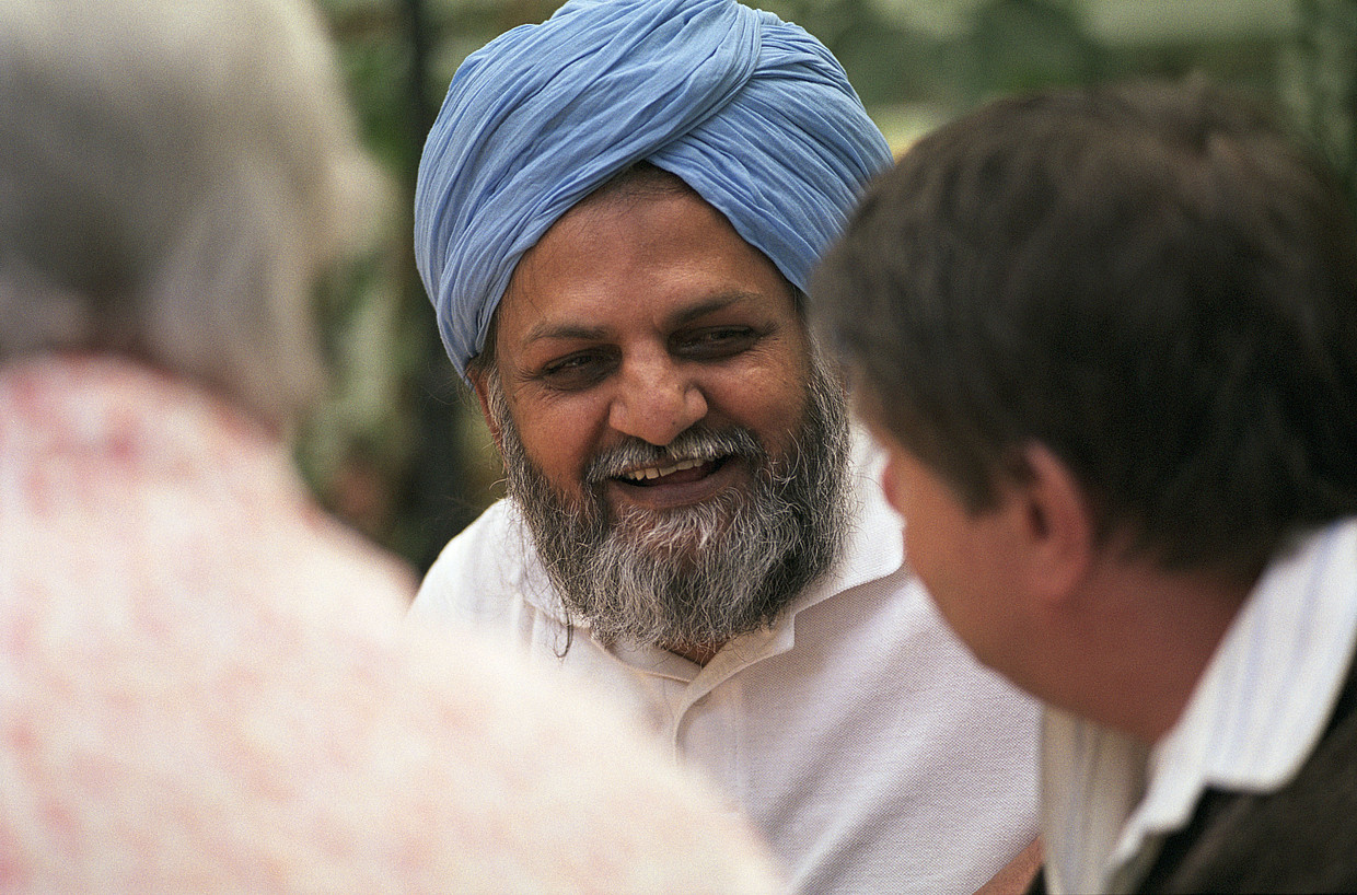 Older South Asian men talking and laughing