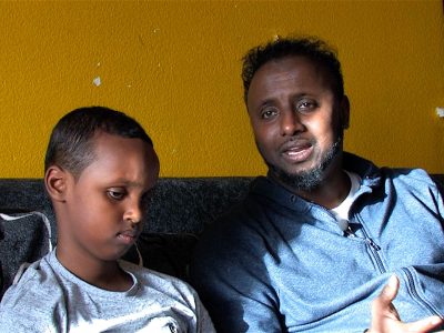 A boy and his father in the short film Overcoming Barriers