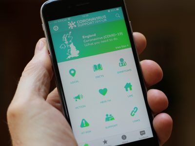 A mobile phone with the Coronavirus Support App welcome screen