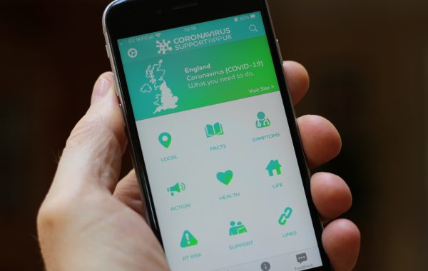 A mobile phone with the Coronavirus Support App welcome screen