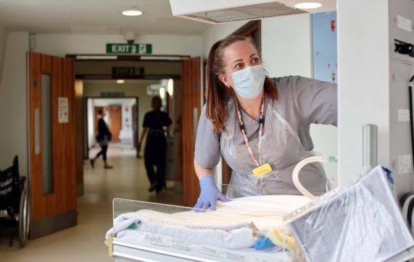 An NHS worker in a face mask