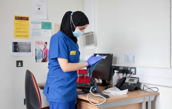 An NHS worker in a face mask