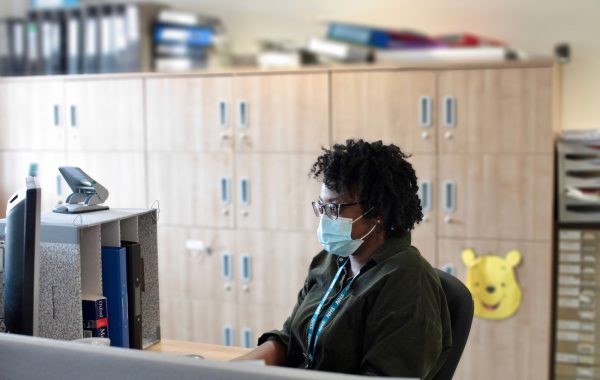 An NHS worker in a face mask