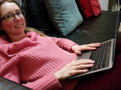 Susan Pywell of our plain language panel, on her laptop
