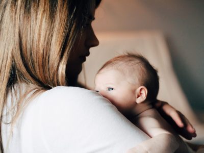 A mother comforts her baby