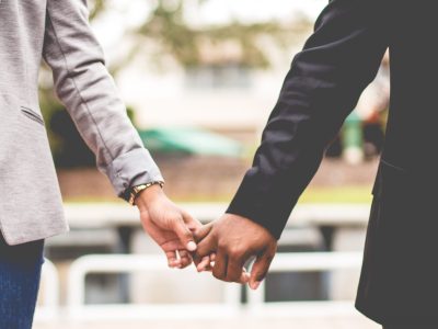 Two people holding hands