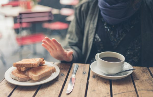A woman with coeliac disease rejects some bread