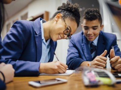 Two secondary school pupils in a class