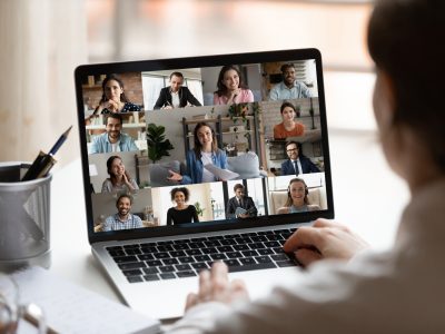 A person uses a laptop to make a Zoom call