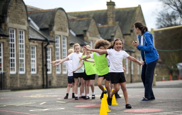 Children during a PE lesson in the school playground