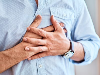 A man clutches his chest