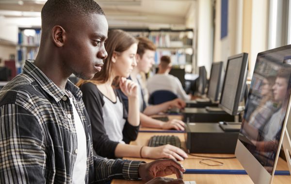 Students using computers in a university library