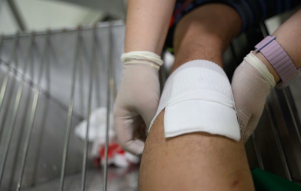 A wound being cleaned and dressed