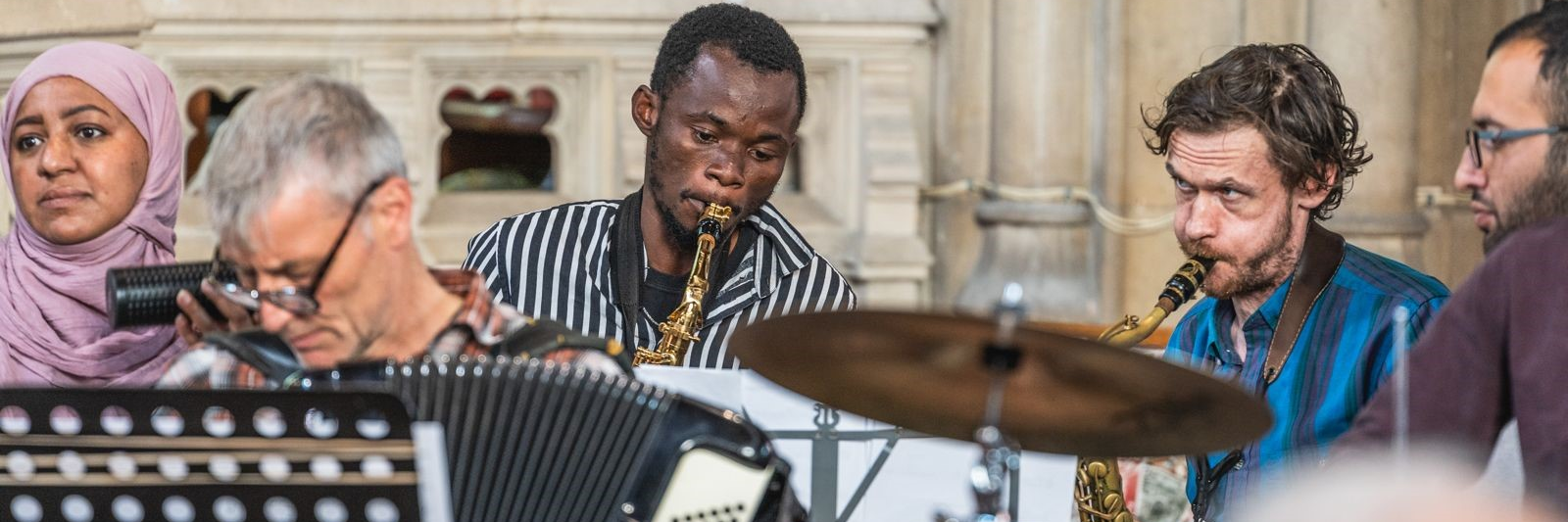 Dovetail Orchestra members playing in Bristol